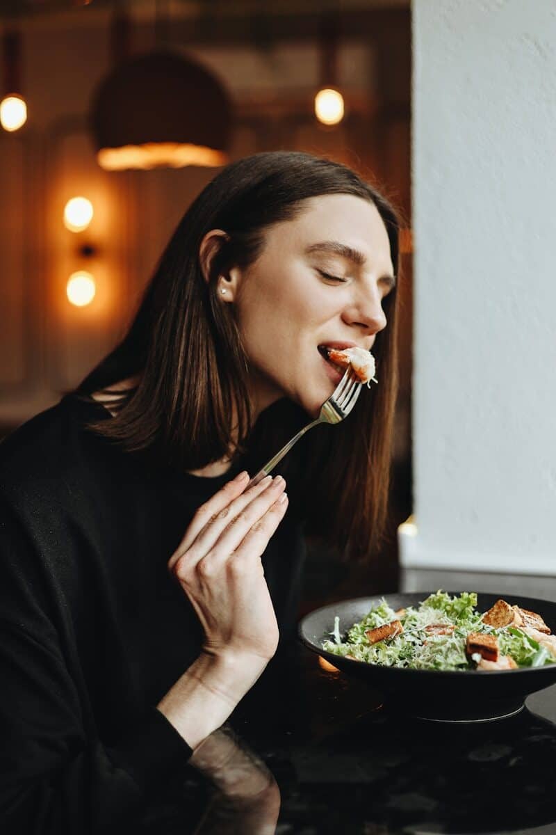 Photo by Natali Hordiiuk a person eating food