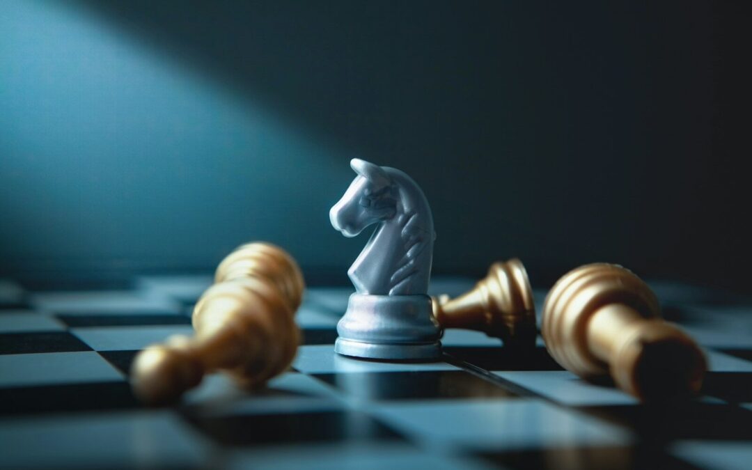 A white knight chess piece stands over fallen gold pieces.